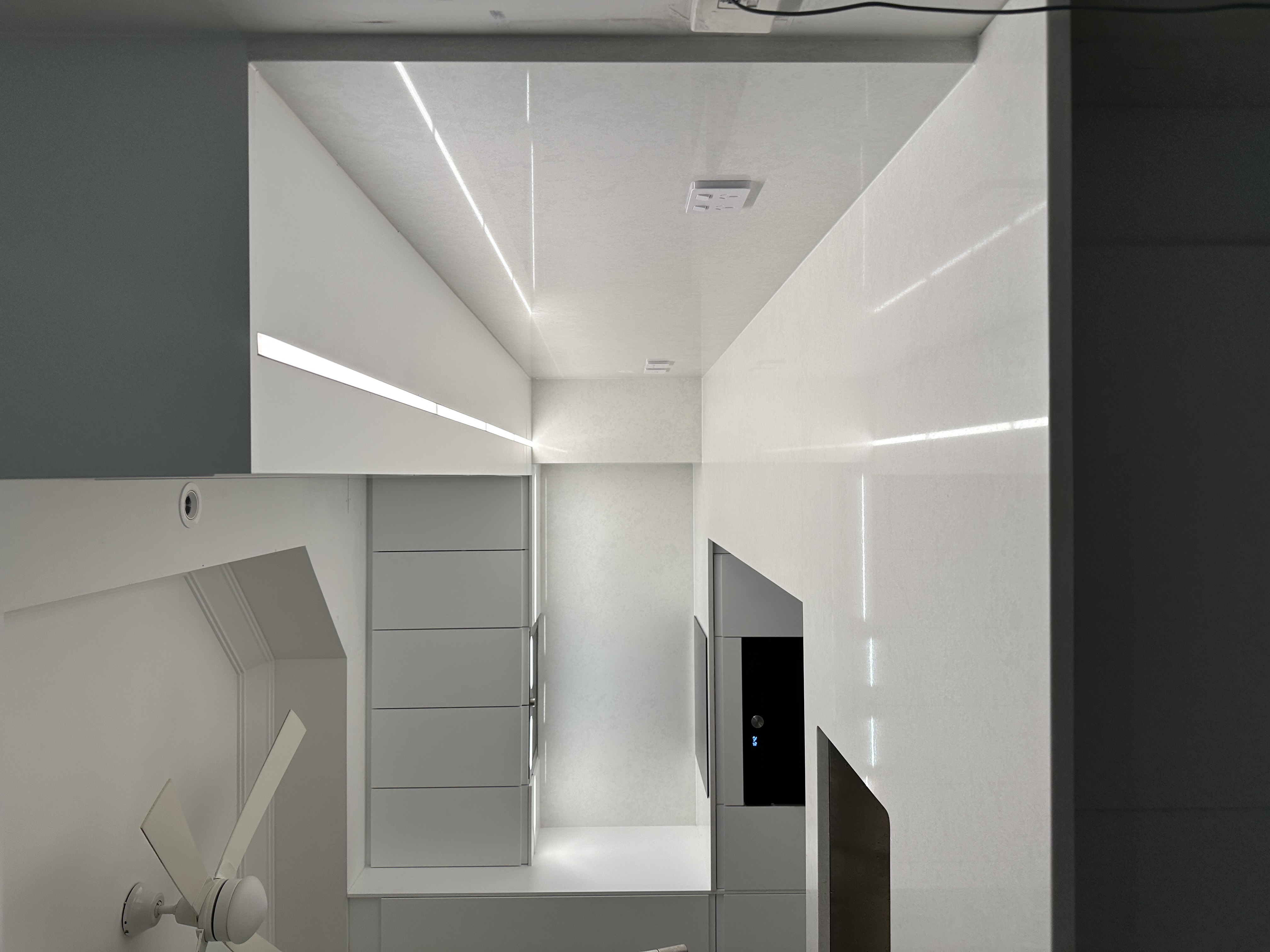 Detailed cabinetry and island angle in minimalist kitchen renovation