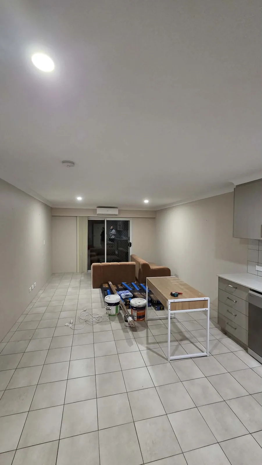 Open-plan apartment refresh with new flooring and a lighter layout