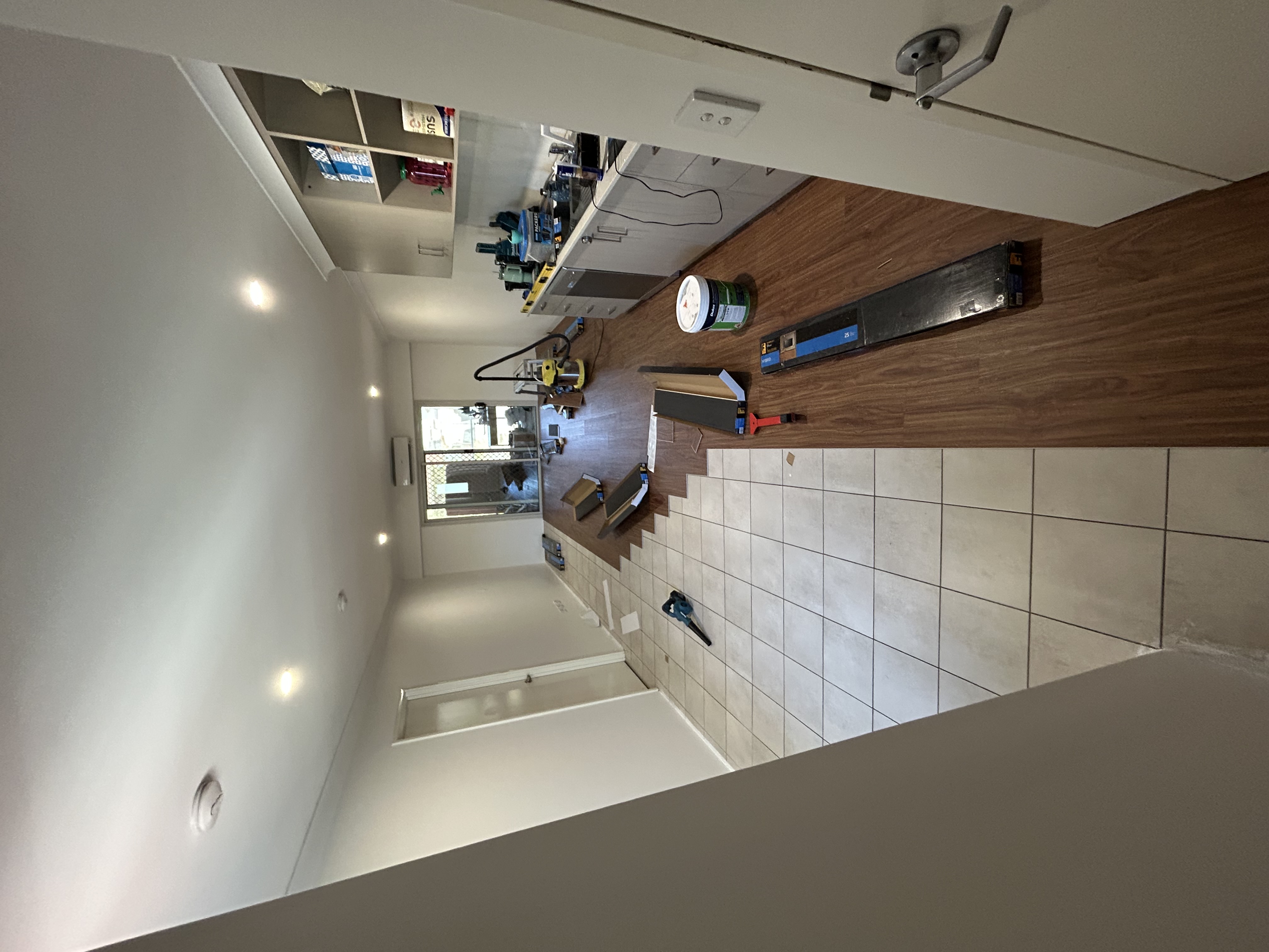 Apartment interior during flooring installation