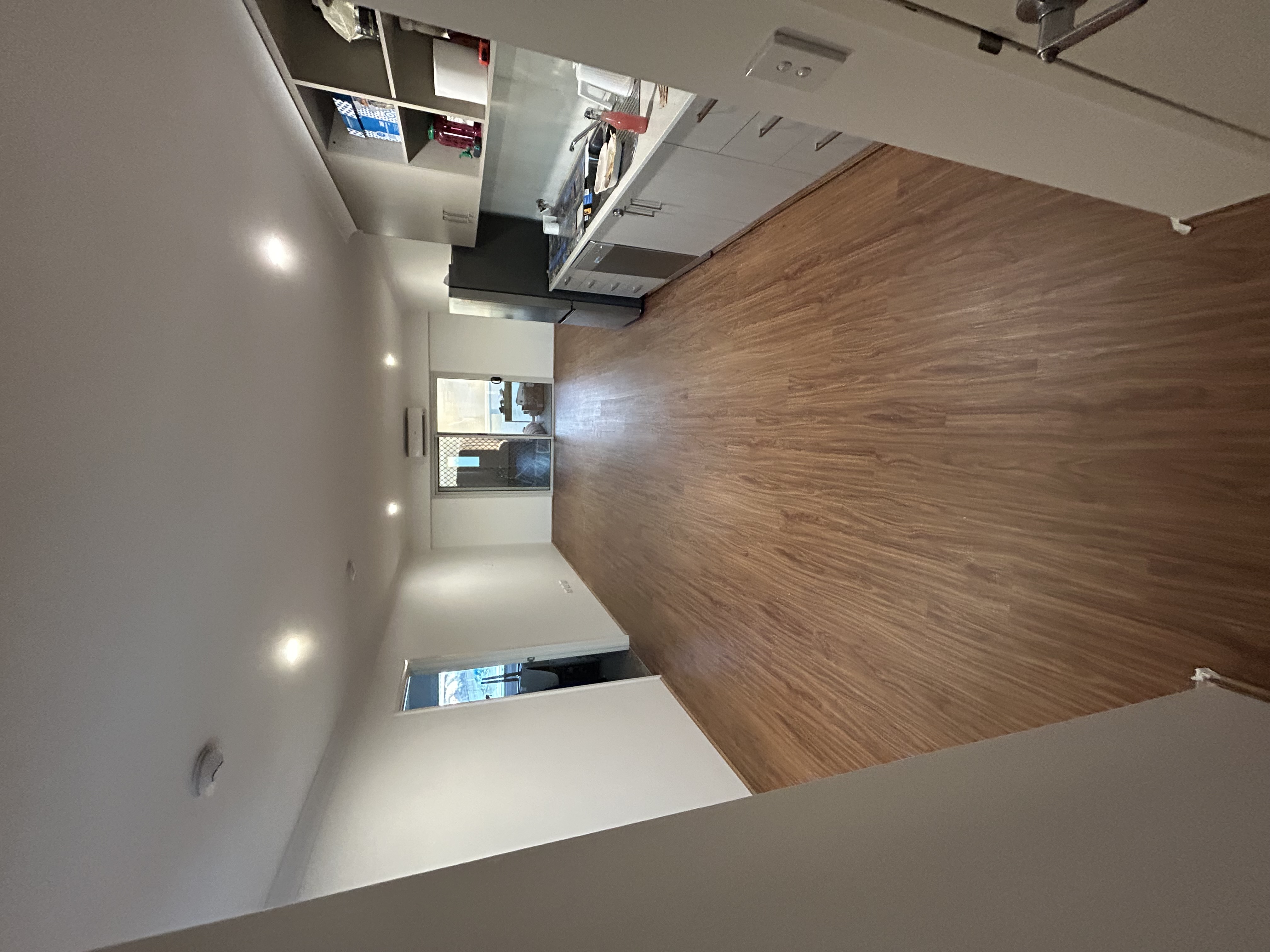 Refreshed kitchen edge within open-plan apartment